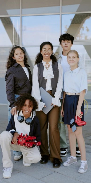 A diverse group of five young individuals standing together, representing the varied backgrounds and experiences that shape today's teens, as explored in the course
