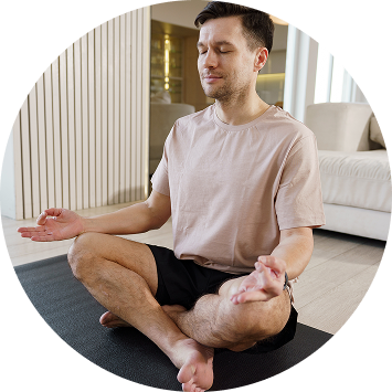 A woman practicing yoga during art of living's sahaj samadhi course