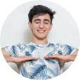 Breathing A smiling male with both his palms facing downwards performing breathing exercise
