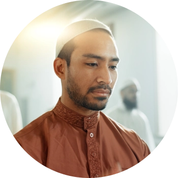 A young Muslim man focusing on his breath 