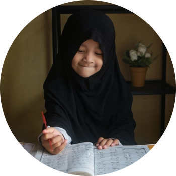 A kid with black burqa writing in her note book and enjoying learning