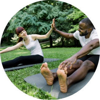Two people encouraging each other after a refreshing yoga session
