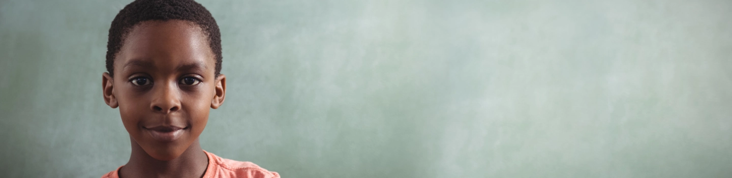 Red-haired child resting chin on hand, reflecting intuitive thought and decision-making.
