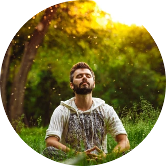peaceful meditation scene with a man surrounded by greenery
