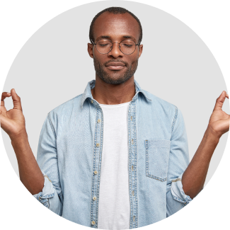 A man posing with hands in chin mudra and eyes closed with gentle smile
