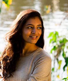 meditation yoga - smiling young woman near a lake