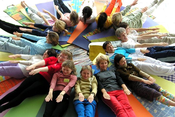 international children and teens enjoying a yoga session