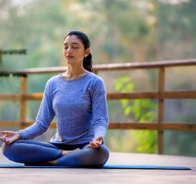 benefits of meditation - girl meditating at blr ashram