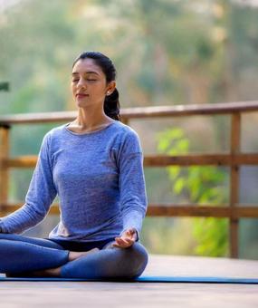 benefits of meditation - girl meditating at blr ashram