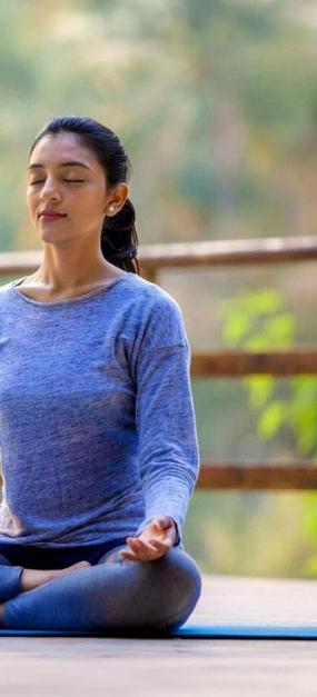 benefits of meditation - girl meditating at blr ashram