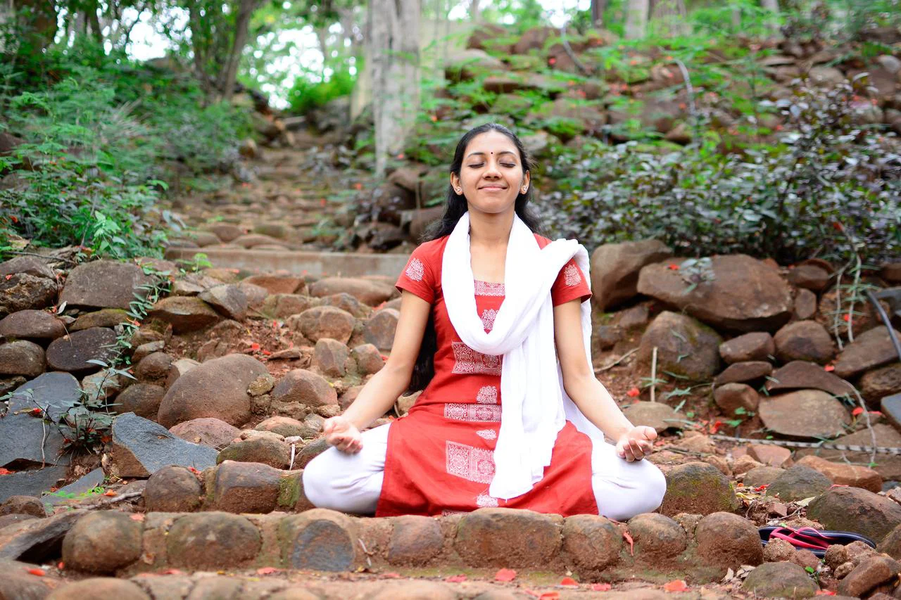 Meditation - Smiling Ekta meditating on the pathway in Ashram