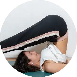 Man performing yoga on a spacious high rise building