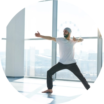 Man performing yoga on a spacious high rise building