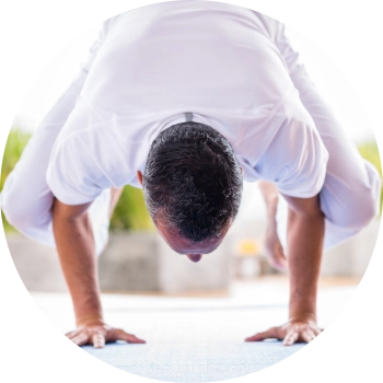 A man performing yoga showcasing core strength and balance