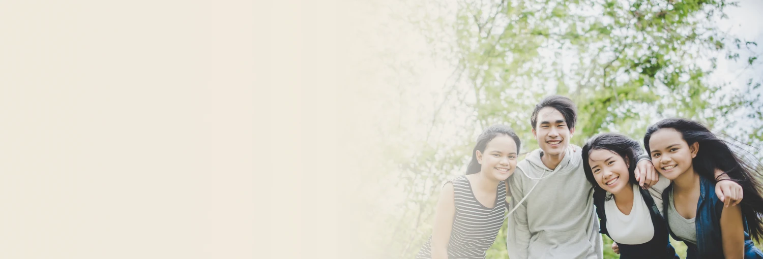 A group of teenagers laughing joyfully at outdoor after teen workshop
