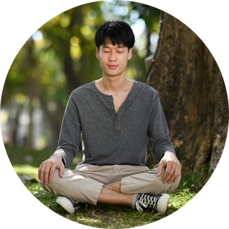 A man sitting under a tree - Meditating