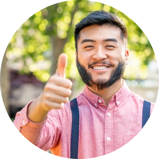 Asian man showing thumbs up with smile and confidence 