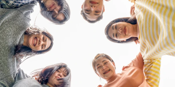 Diverse group of YES! program participants practicing yoga techniques during leadership training