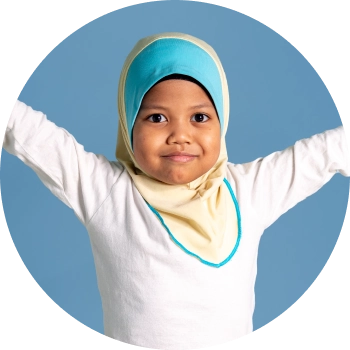 Child in blue hijab with out stretched arms and smiling softly
