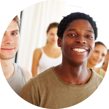 Group of teenage students looking at the camera and smiling happily