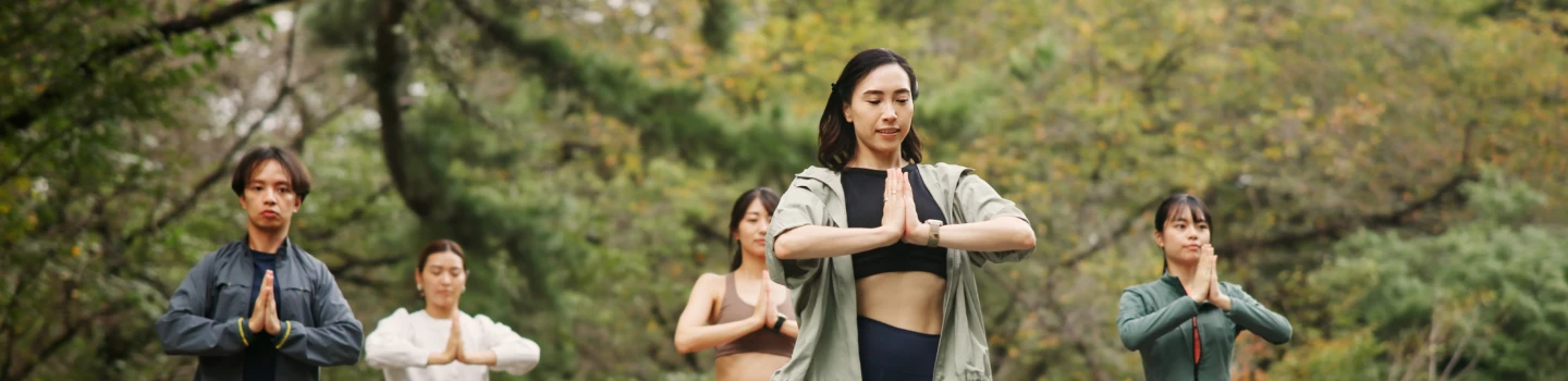 Yoga practitioners showcasing the health benefits of the Sri Sri Yoga Level 2 program