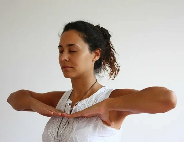 Women practicing second stage pranayama