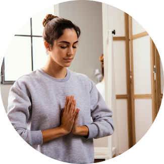 Confident teenage girl with long brown hair in a plaid shirt over a red top, smiling with arms crossed, representing resilience through the YES! Program