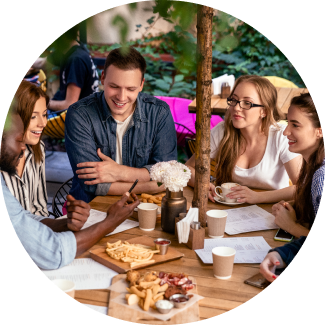 A smiling man with curly hair, hands on his head, expressing joy and reduced anxiety as part of the Art of Living Shakti Kriya program