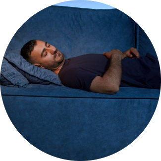 Man dosed off peacefully on a couch