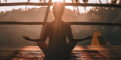 peaceful meditation scene with a women drenched in sunlight