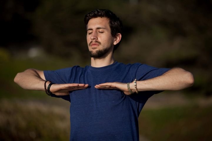 Man practicing SKY Breath Meditation to support nervous system regulation.