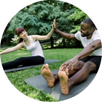 Two people encouraging each other after a refreshing yoga session