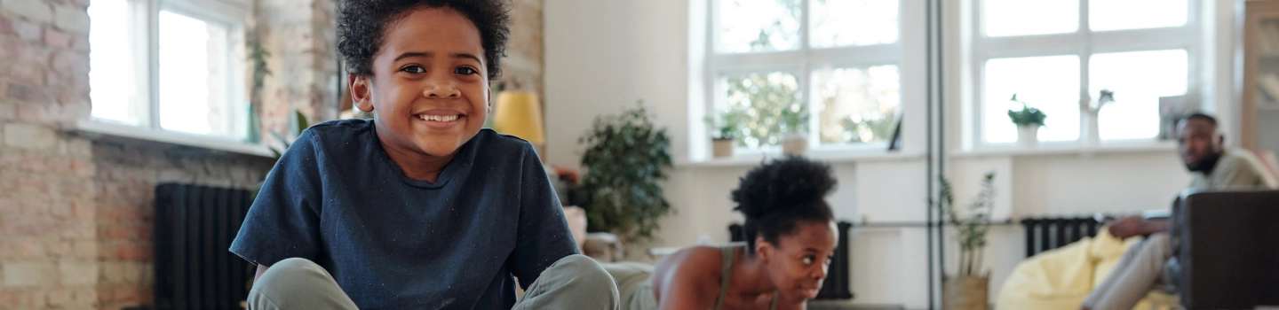 Group of children performing yoga at a studio, showcasing learning